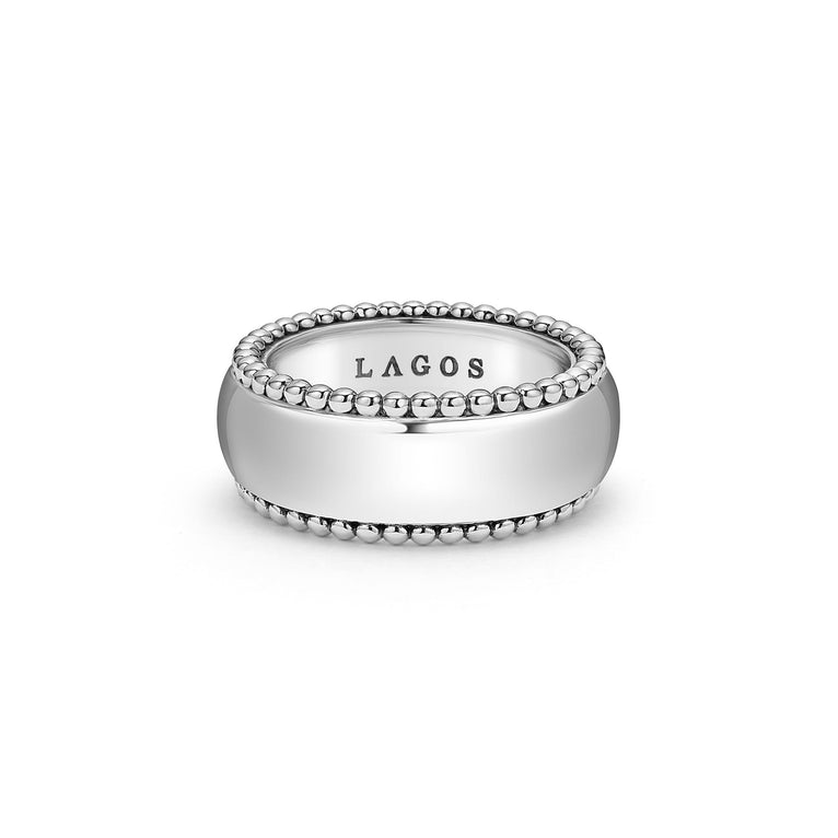 A ring is in the middle of a white background featuring Smooth sterling silver and Caviar beading