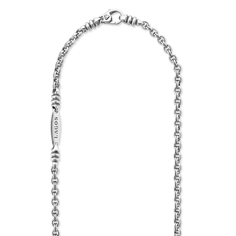 A sterling silver chain highlighting the clasp featuring Sterling silver fluted links and double link Caviar chain