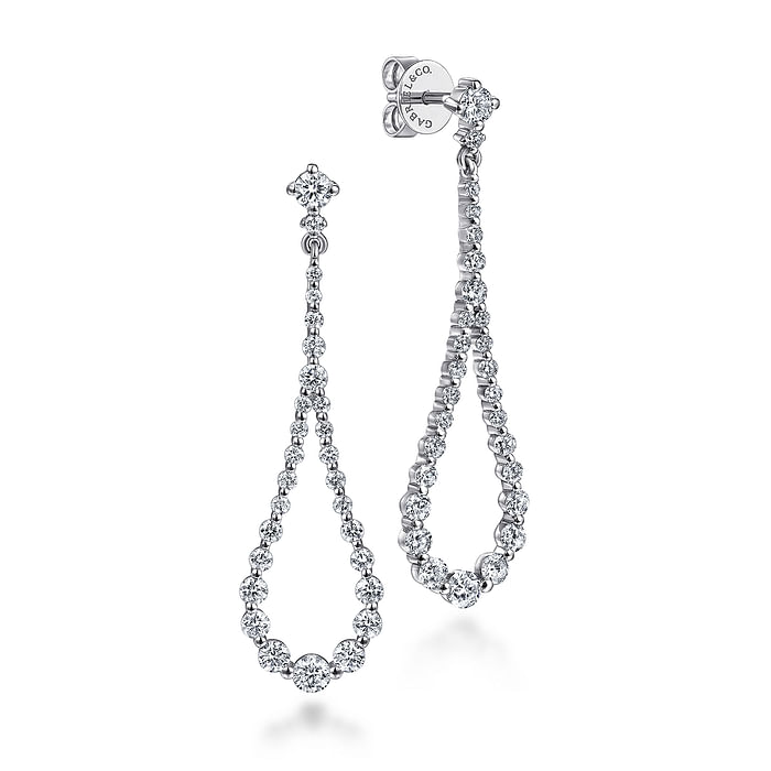 A pair of drop earrings featuring diamond studs size of the diamond gets bigger towards the bottom.