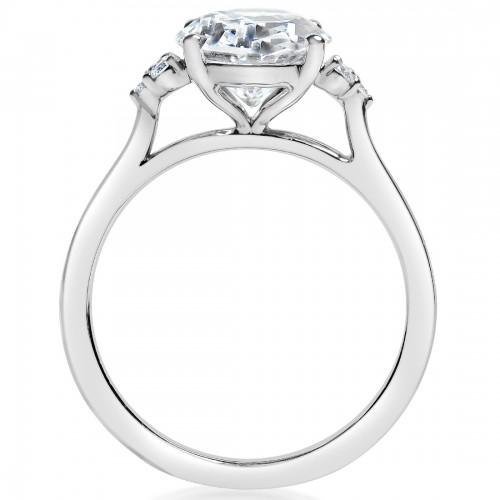 A side-view of the Cluster Side Stone Engagement Ring, made of white gold. The side view shows the diamond's pavilion and the whole gold band.