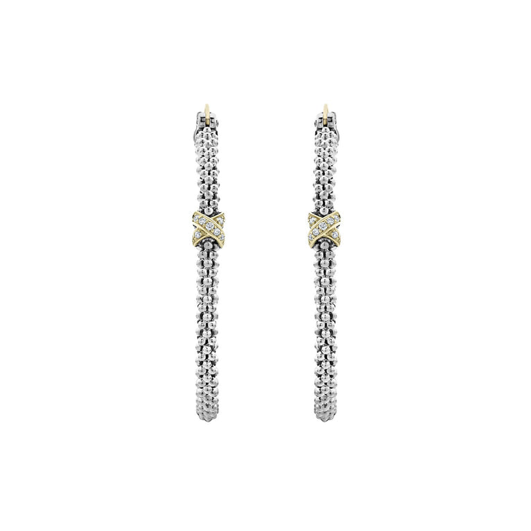 A pair of hoop earrings with a diamond and 18K gold x station with sterling silver caviar beading. 