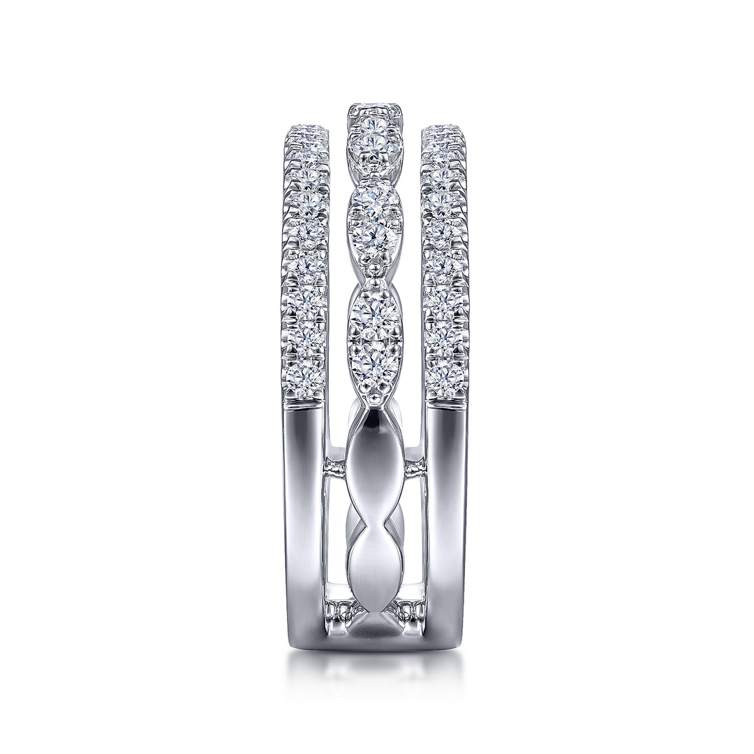 A side view of a white gold diamond row against a white background. The ring features a three-row design with two outer bands featuring straight strands of glittering pavé diamonds, while the central row of diamonds is sculpted into a series of elegant marquise shapes.
