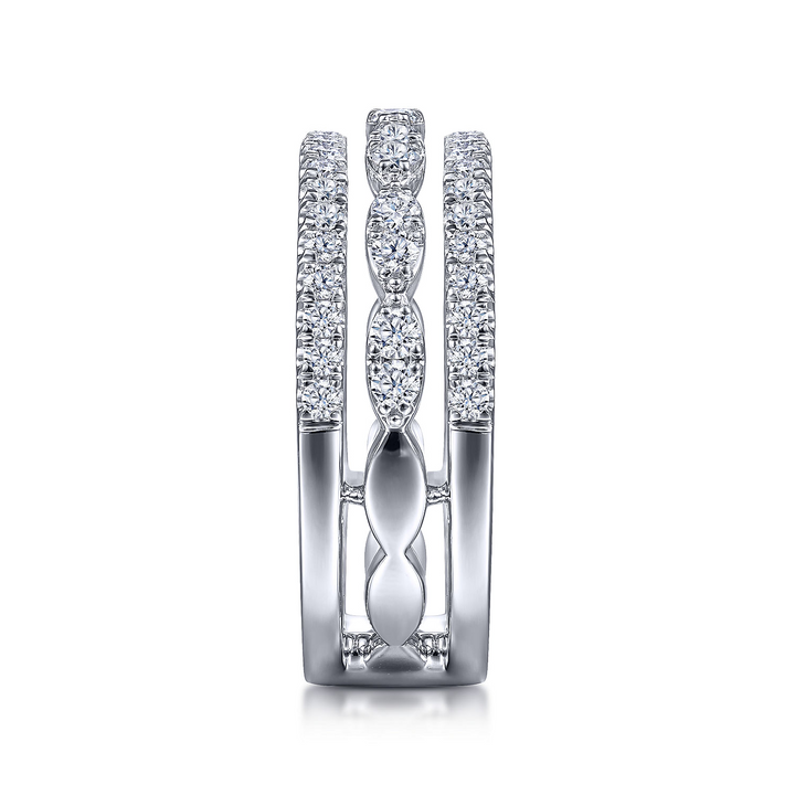 A side view of a white gold diamond row against a white background. The ring features a three-row design with two outer bands featuring straight strands of glittering pavé diamonds, while the central row of diamonds is sculpted into a series of elegant marquise shapes.