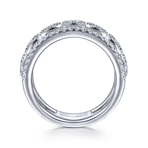 A top view of a white gold diamond row against a white background. The ring features a three-row design with two outer bands featuring straight strands of glittering pavé diamonds, while the central row of diamonds is sculpted into a series of elegant marquise shapes.