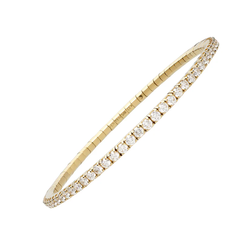 Angled view of the Extensible 14K yellow gold tennis stretch bracelet with a continuous row of round diamonds