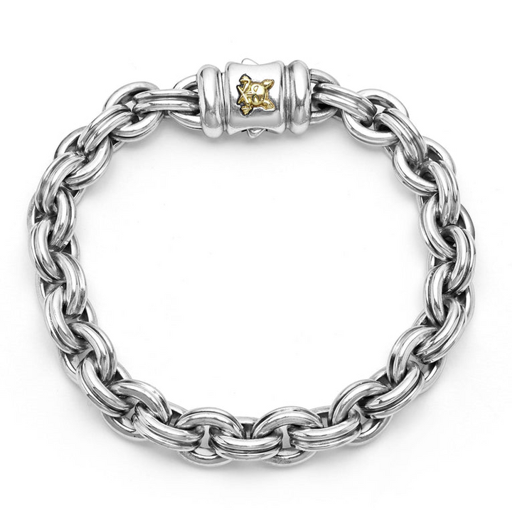 A sterling silver bracelet in the middle of a white background featuring double link chain and krunch crescent on the clasp