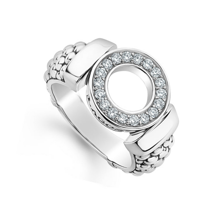 A sterling silver ring angled to the right in the middle of a white background featuring a diamond circle design and caviar beading.