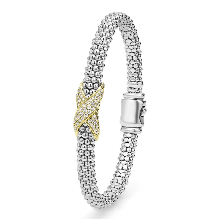 A Sterling Silver & 18k gold bracelet angled to the side against a white background. The bracelet features a diamond-set X station, caviar beading, and a stainless steel clasp.