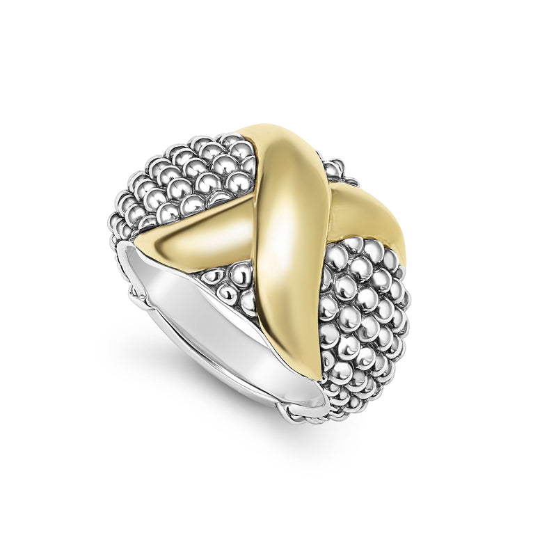 A sterling silver and 18k gold ring displayed angled in the middle of a white background featuring smooth 18K gold and silver Caviar beading with an X motif.