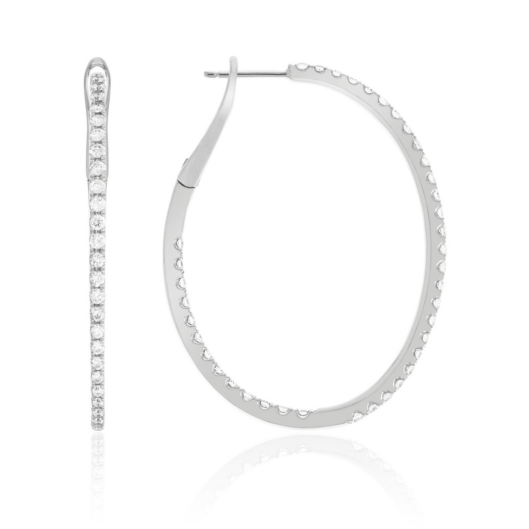 A pair of hoop earrings with a single row of round diamonds. The right earring is angled to the side.