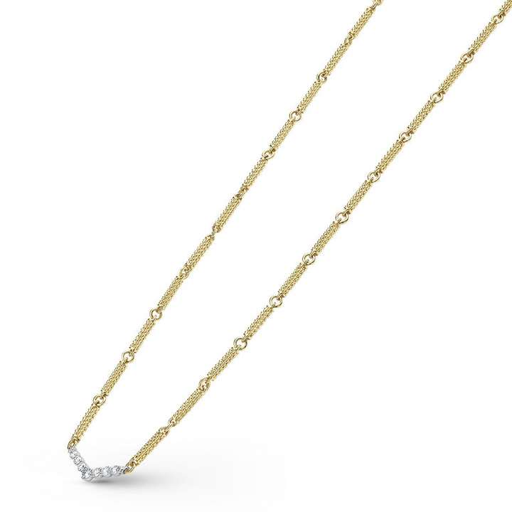 A close-up of an 18k gold necklace angled to the right, featuring caviar beading and a white gold chevron design against a white background.