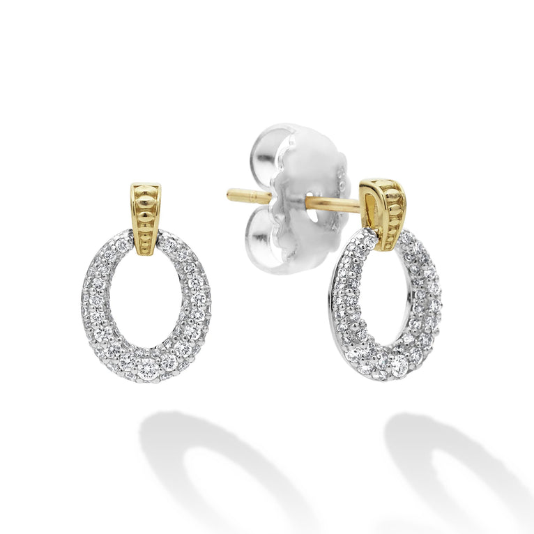 A pair of drop earrings with oval drop highlighted by 18k gold Caviar beading. The right earring is angled to the side, showing the back.