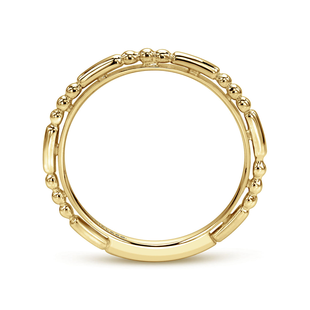 A side view of a ring made of yellow gold. The side view shows the yellow-gold band from the top.