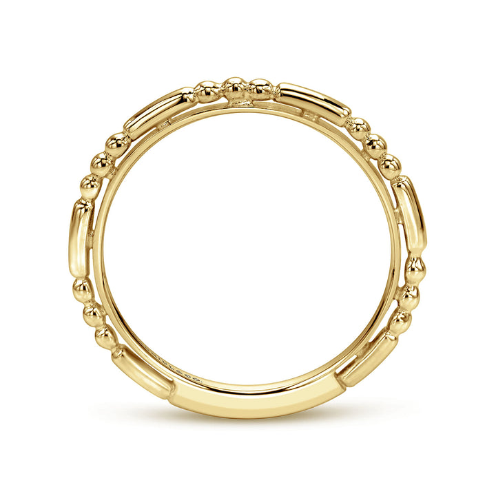 A side view of a ring made of yellow gold. The side view shows the yellow-gold band from the top.