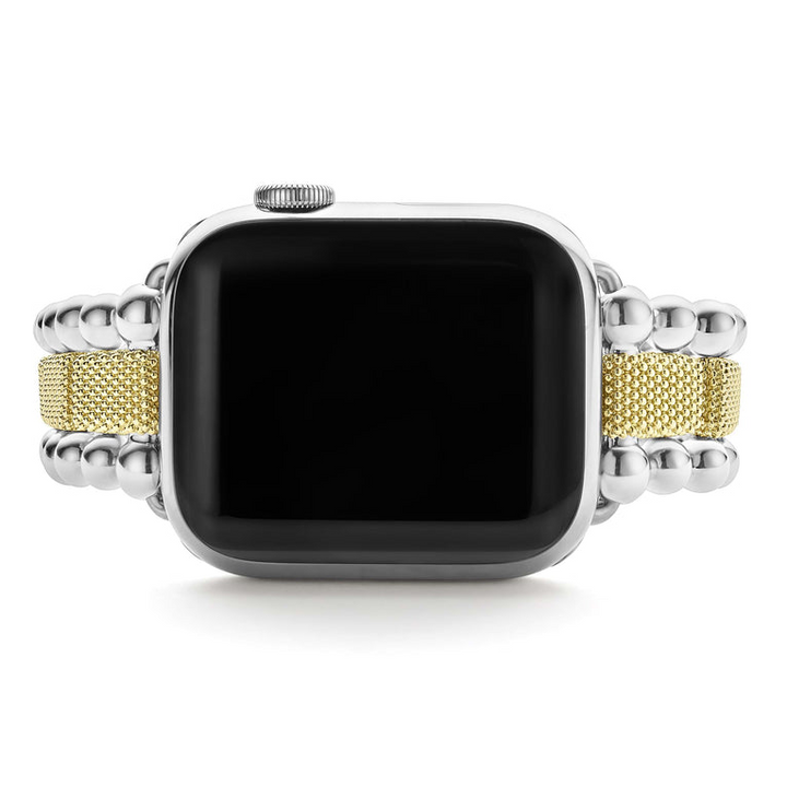 An Apple watch rests in the middle vertically against a white background, showcasing the Apple watch's face. The watch band features 18K gold-stationed links and stainless steel beading around the links.