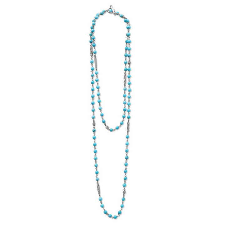 A sterling silver and ceramic beaded necklace in the middle of a white background featuring Turquoise ceramic and silver Caviar beading.