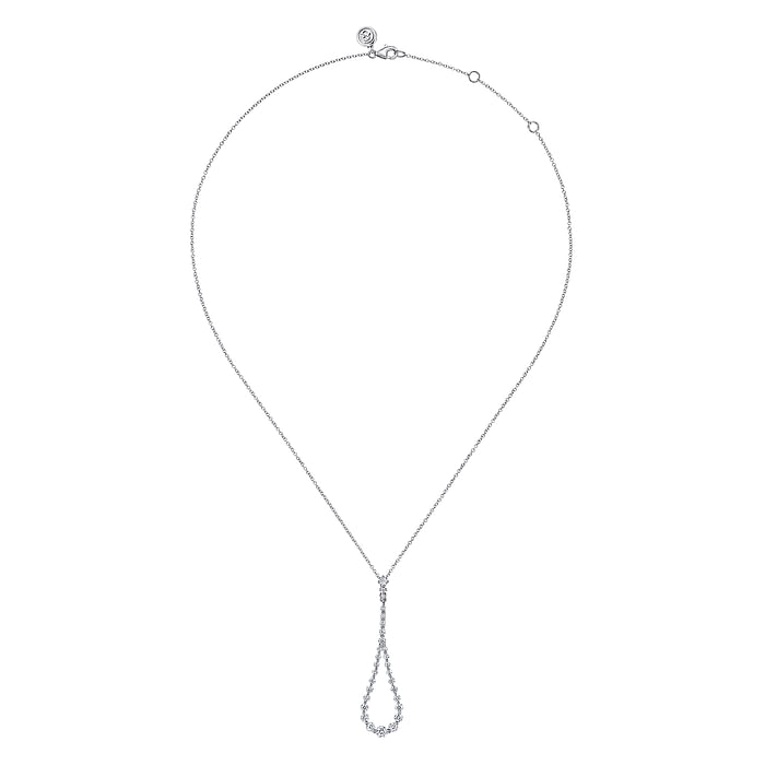 A white-gold Diamond Pendant Drop Necklace is in the middle of a white background. The necklace features a drop pendant in a loop design set with diamonds and a 14k white gold chain. 