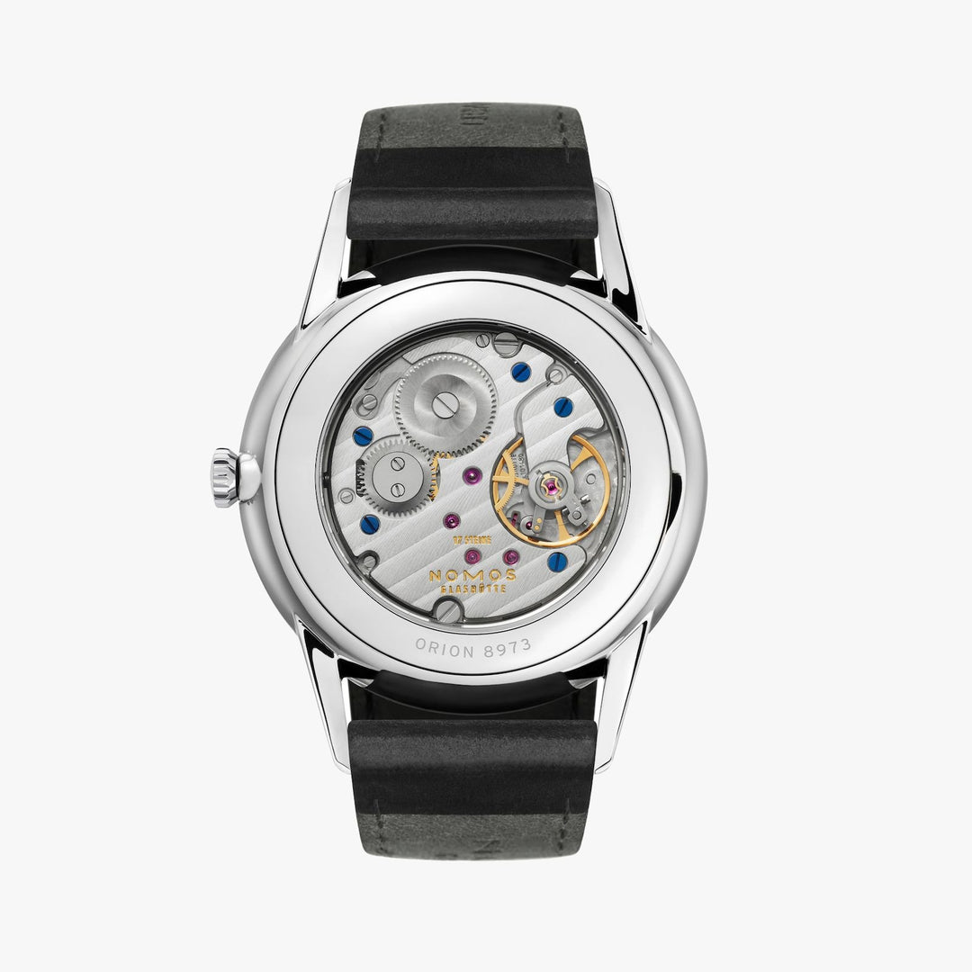 The back of a Nomos Glashutte watch showcases the back of the dial, stainless steel bezel, and strap.