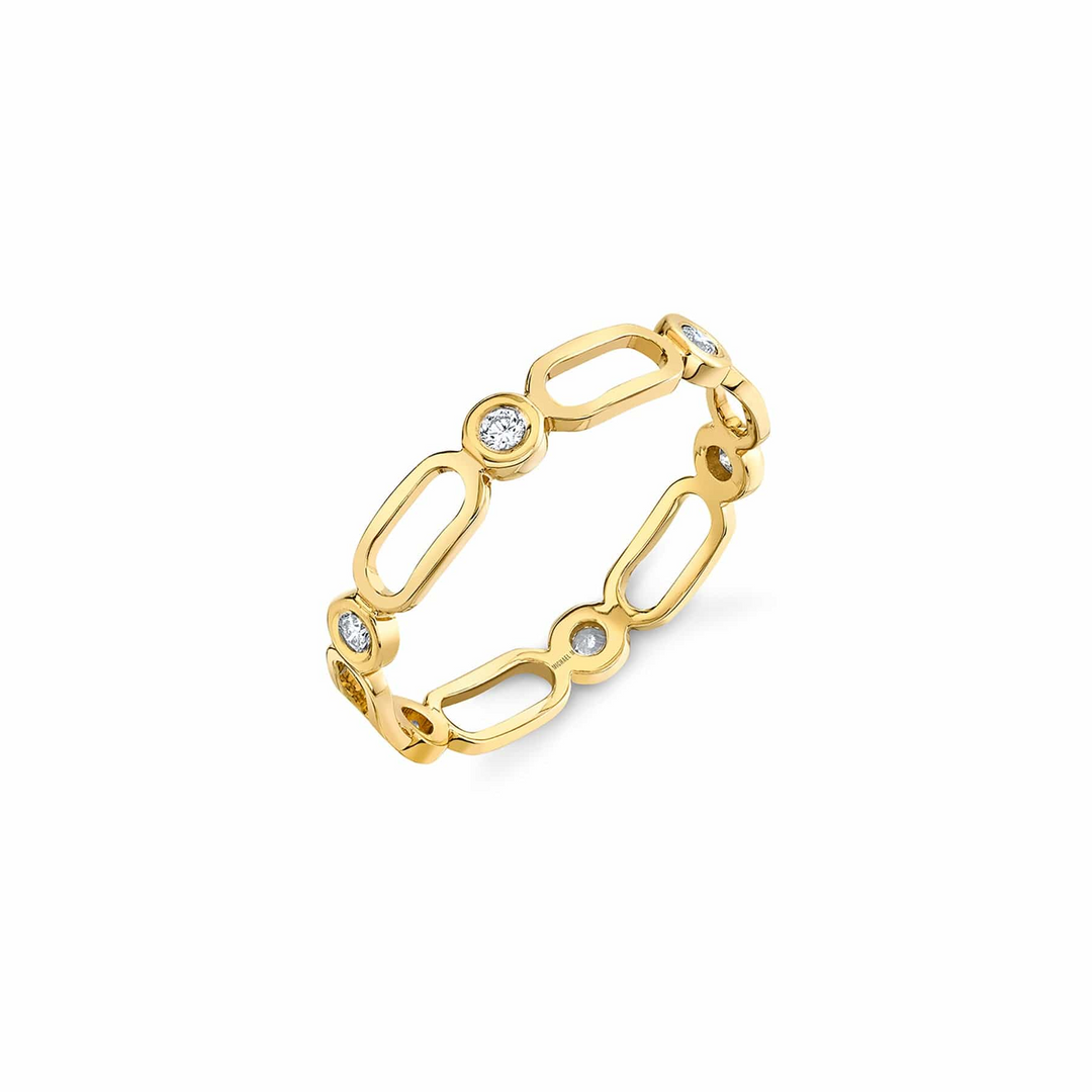 A yellow-gold ring lying flat against a white background. The ring features alternating links and diamond-set bezel pattern stacks.