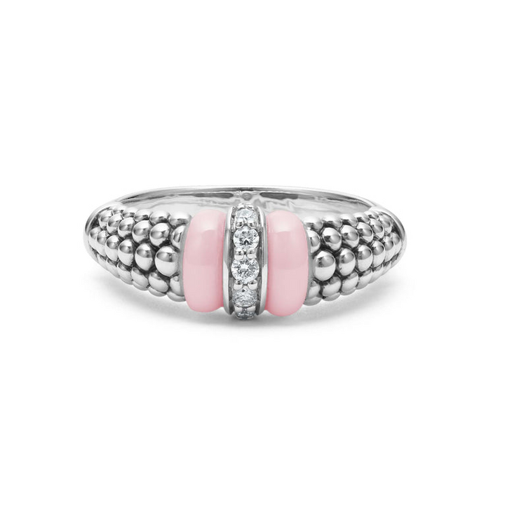 A sterling silver ring is displayed on a white background featuring pink ceramic caviar beading with a row of diamonds.