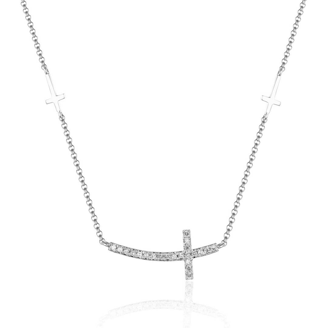 A close-up of a white-gold Side Cross Diamond Necklace against a white background. The necklace features a diamond-set cross pendant with two cross designs on the side.