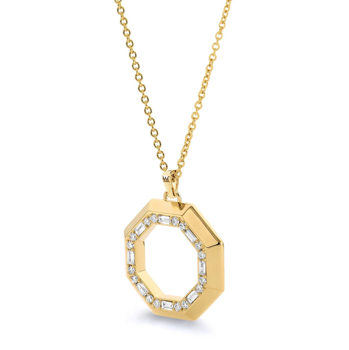 A yellow-gold necklace lying flat across a white background. The necklace features a hexagon motif pendant with a halo.