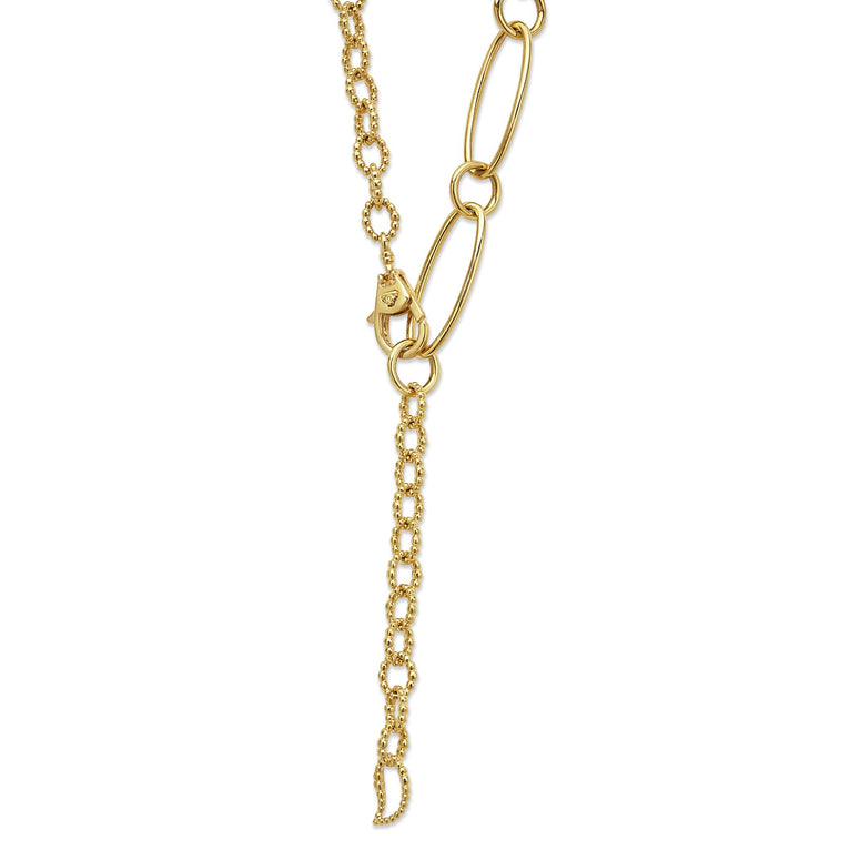 A close-up of an 18k gold link necklace highlighting the clasp.