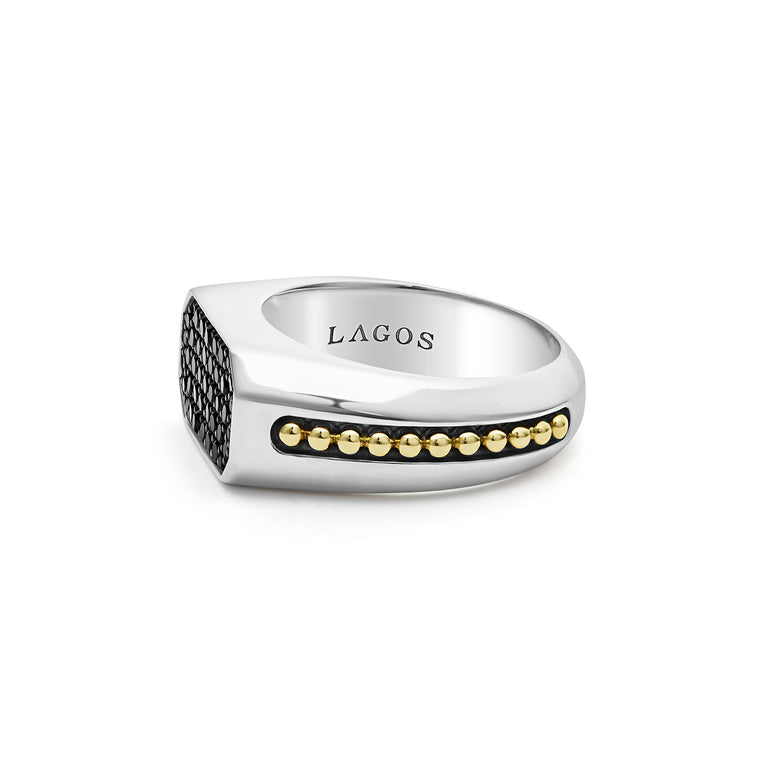 A side-view of a Sterling Silver & 18K Gold ring in the middle of a white background, featuring black diamonds accented by sterling silver and 18K gold Caviar beading