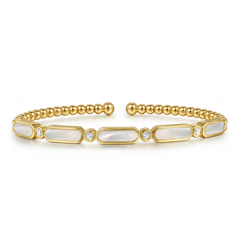 Gabriel & Co Bujukan yellow gold bangle featuring white mother-of-pearl stations, diamond accents and beaded detailing.