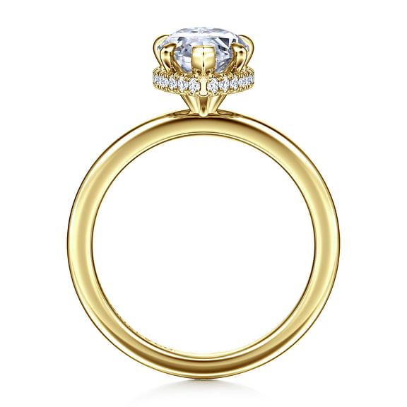 Profile view of a 14K yellow gold pear engagement ring showing the raised center setting and hidden diamond halo above the polished band.