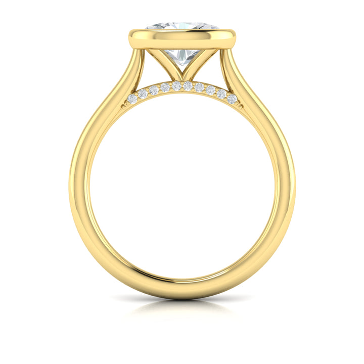 A top view of a yellow gold engagement ring is set against a white background. The engagement ring features a bezel-set east-west oval diamond center stone, cradled in a cathedral arch, and has subtle pavé detailing around the yellow gold band.