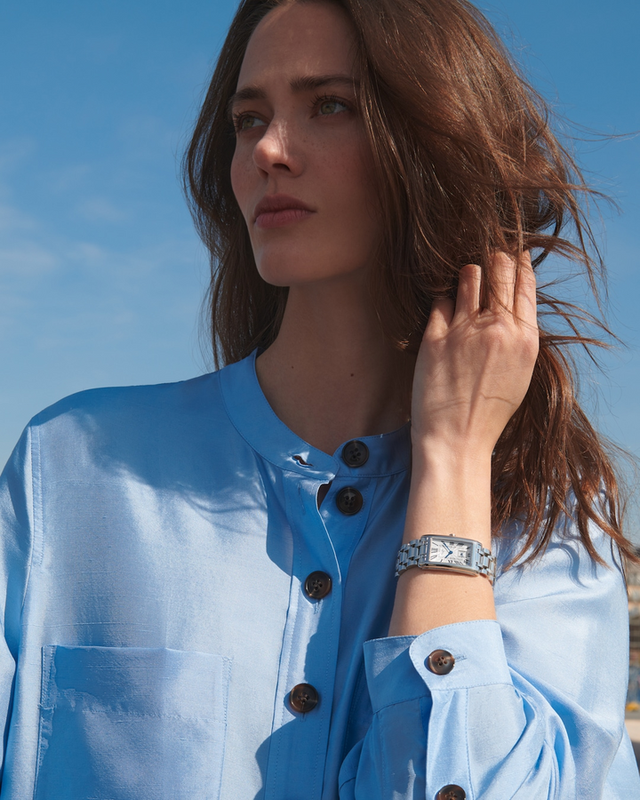 LONGINES DolceVita L5.512.4.71.6 Stainless Steel Watch Worn on Wrist With Light Blue Blouse