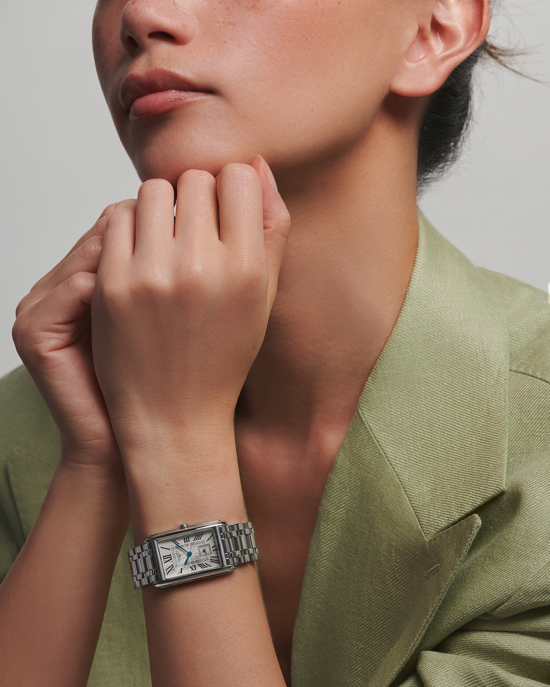 LONGINES DolceVita L5.512.4.71.6 Silver Dial Watch Worn on Wrist With Light Green Blazer