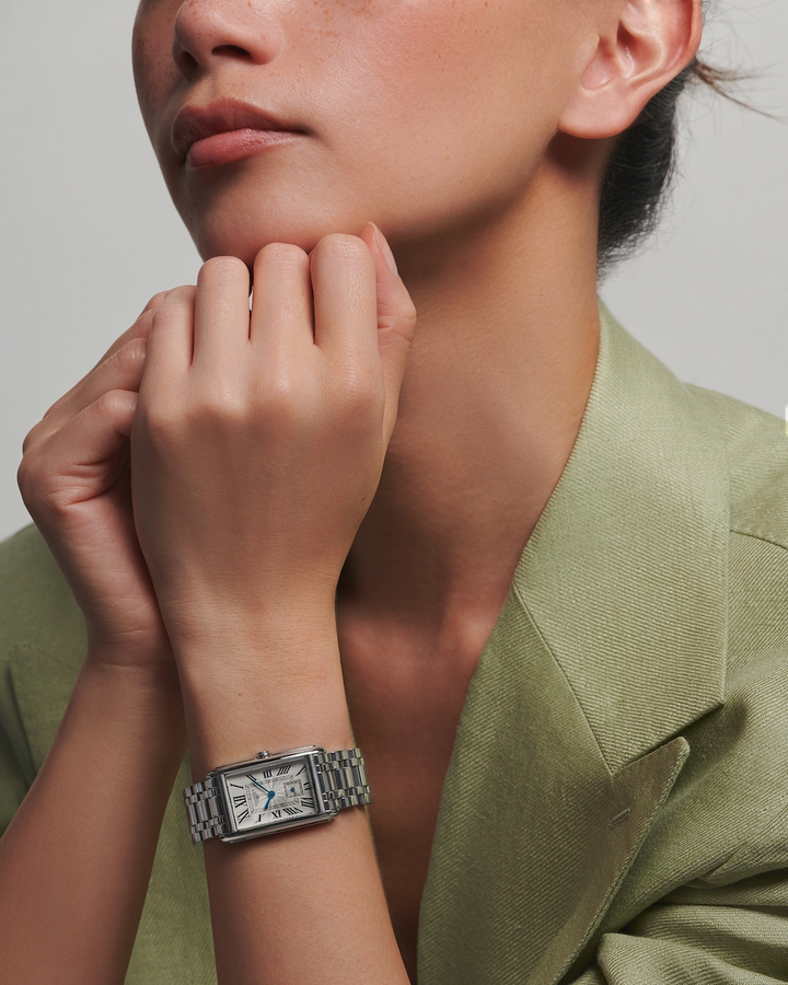 LONGINES DolceVita L5.512.4.71.6 Silver Dial Watch Worn on Wrist With Light Green Blazer