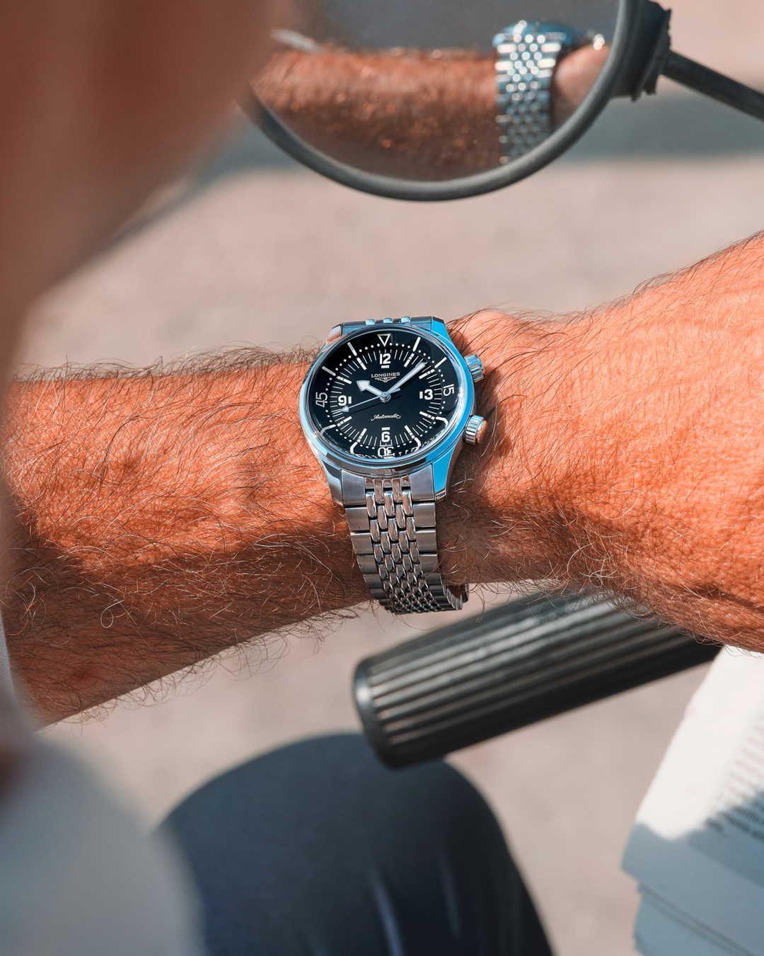 LONGINES Legend Diver L3.764.4.50.7 Stainless Steel Watch Worn on Wrist With Sunglasses Reflection