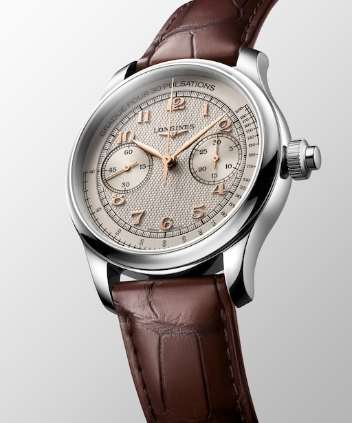 Angled view of the LONGINES Master Collection Chrono Monopusher L2.960.4.78.2 with an ivory dial and brown leather strap.