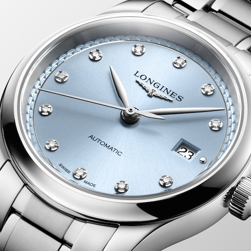 Close-up of the LONGINES Master Collection L2.449.4.97.6 blue dial with diamond hour markers and a date window.