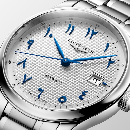 Close-up of the LONGINES Master Collection L2.950.4.79.6 silver textured dial with blue Arabic numerals and hands.