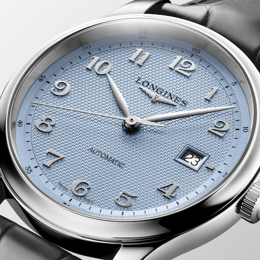 Close-up of the LONGINES Master Collection L2.950.4.99.2 light blue textured dial, Arabic numerals and date window.