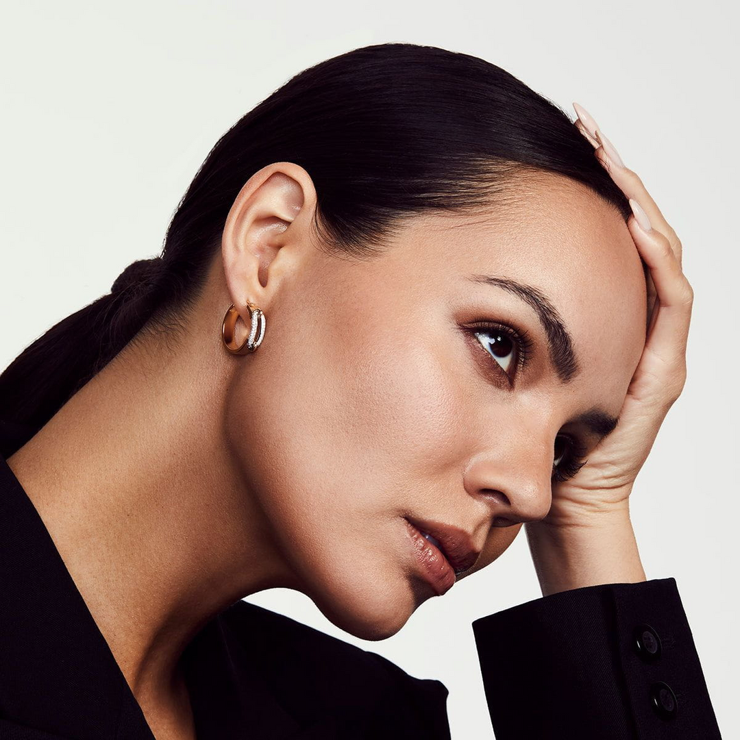 Model wearing MICHAEL M Pavé Wide Luxe Link hoop earrings, showing the yellow gold hoops and diamond-set white gold links.