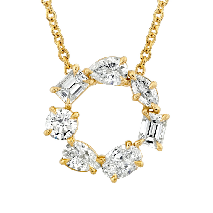 A close-up view of a yellow gold pendant necklace against a white background, showing the diamond pendant. The ring features two pear-cut diamonds, two emerald-cut diamonds, one marquise-cut diamond, one round-cut diamond, and one oval-cut diamond custer design pendant.