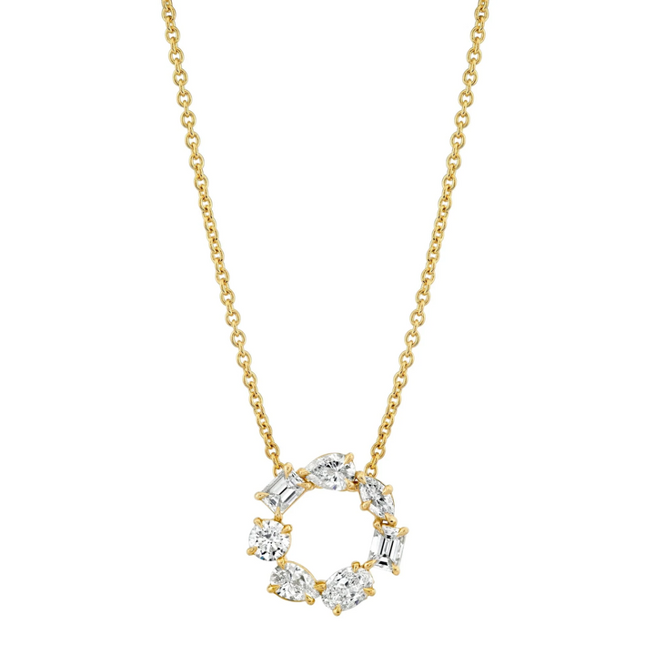 A front view of a yellow gold pendant necklace against a white background. The ring features two pear-cut diamonds, two emerald-cut diamonds, one marquise-cut diamond, one round-cut diamond, and one oval-cut diamond custer design pendant.