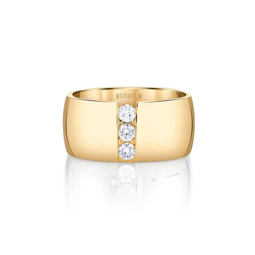 A front view of a yellow gold diamond ring against a white background. The ring features the timeless ring shape split down the middle with a perfect line of floating diamonds.
