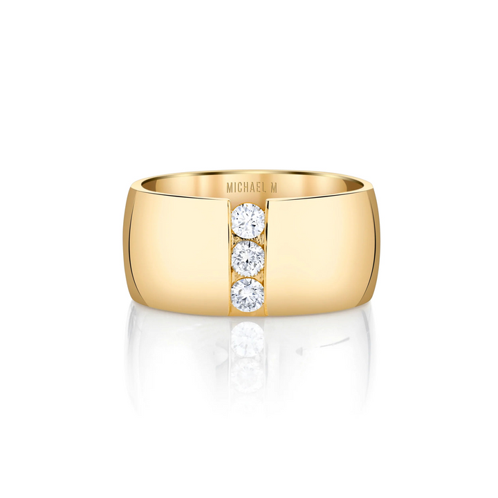 A front view of a yellow gold diamond ring against a white background. The ring features the timeless ring shape split down the middle with a perfect line of floating diamonds.