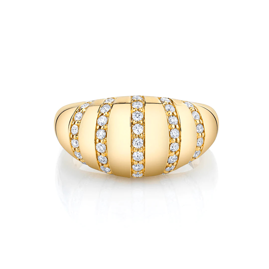 A front view of a yellow gold diamond ring against a white background. The ring features diamond-set rows of tiny pavé diamonds that line the softly rounded golden surface of the domed signet ring.