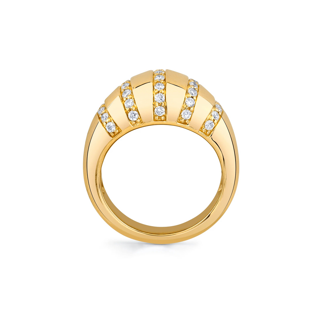 A side view of a yellow gold diamond ring against a white background. The ring features diamond-set rows of tiny pavé diamonds that line the softly rounded golden surface of the domed signet ring.