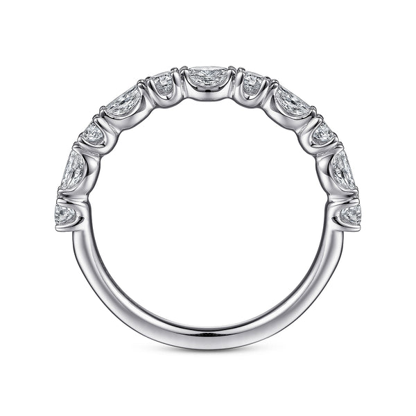 A side profile view of a white gold wedding band against a white background. The ring features a half eternity style with alternating oval and round diamonds set in white gold prongs.