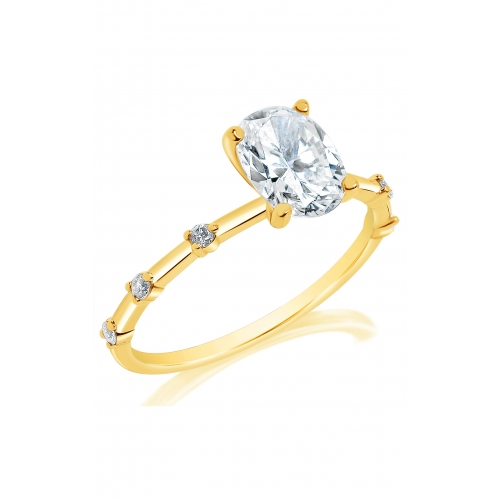 Angled view of a Classique Creations oval engagement ring showing the raised center diamond and round accents spaced along the yellow gold band.