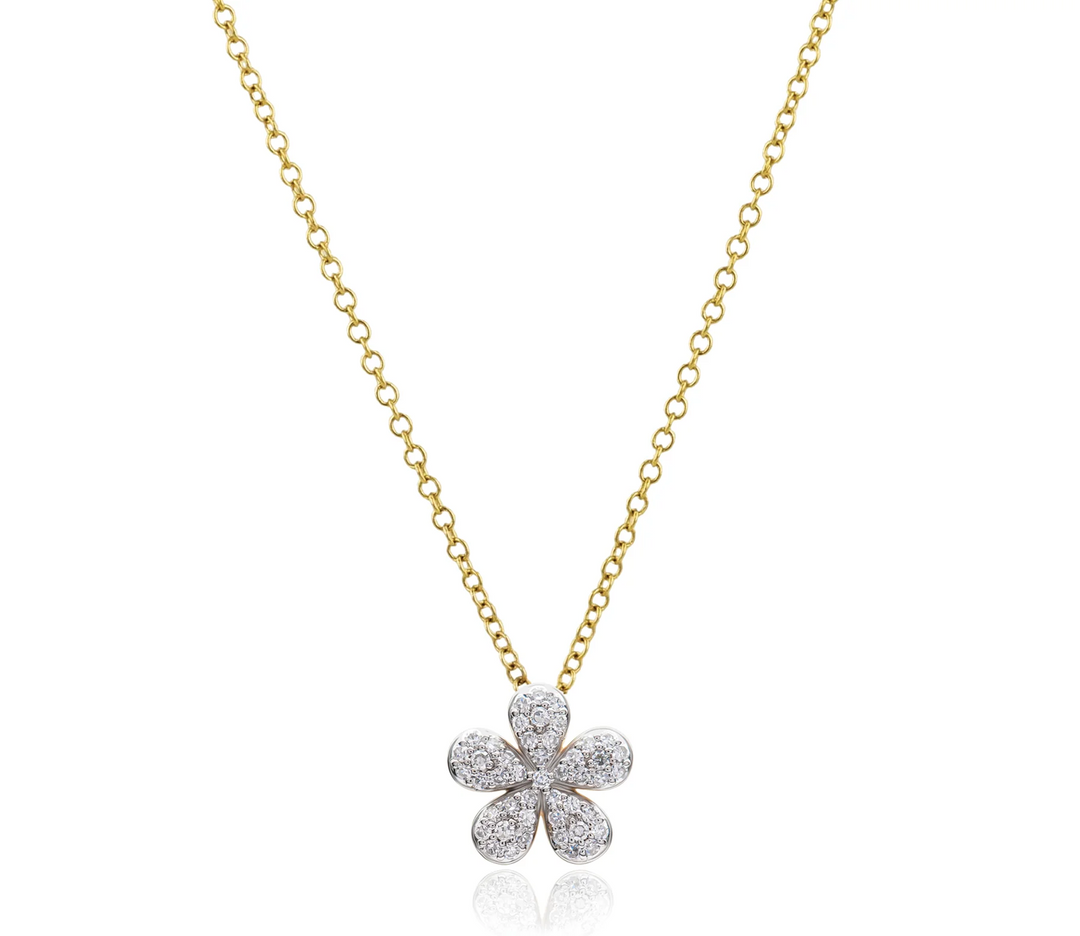 Phillips House Forget-Me-Not Petite Necklace with a curved pavé diamond flower pendant suspended from a yellow gold chain.