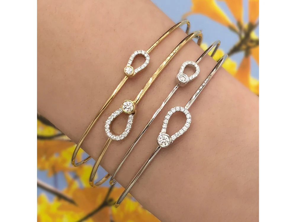 Model wearing the Phillips House Mini Keyhole Love Always diamond bracelet, showing its slim gold band on the wrist.